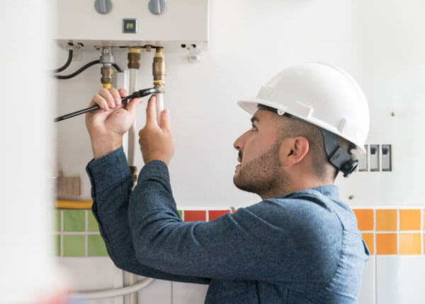 Plumber working on gas lines